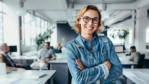 A confident female entrepreneur with her arms crossed.